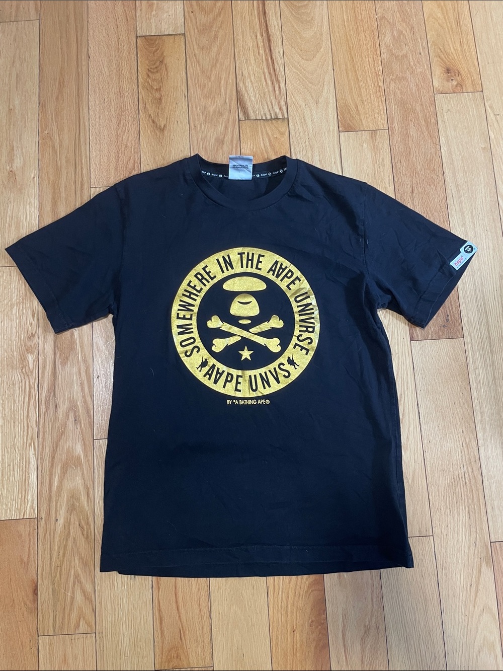 A Bathing Ape Black Short-Sleeve Graphic Tee with Yellow Emblem